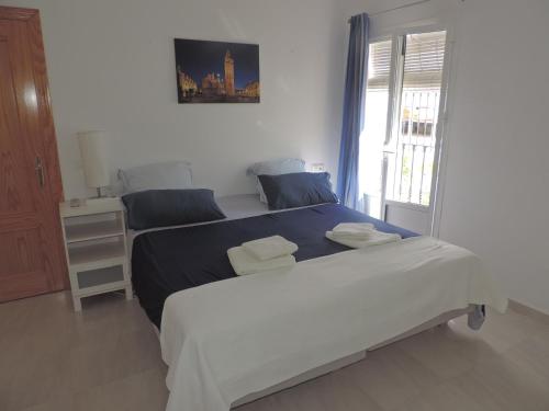 Ένα ή περισσότερα κρεβάτια σε δωμάτιο στο Casa Cal y Sol