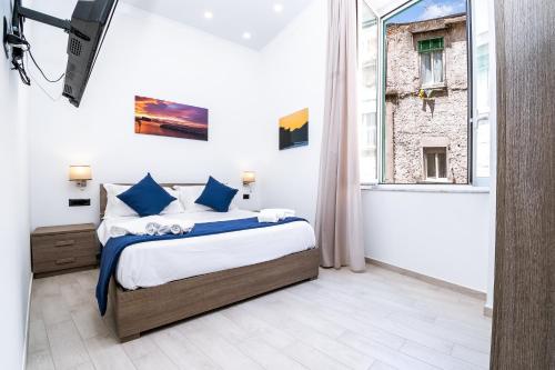 Postel nebo postele na pokoji v ubytování Palazzo Settembrini 49