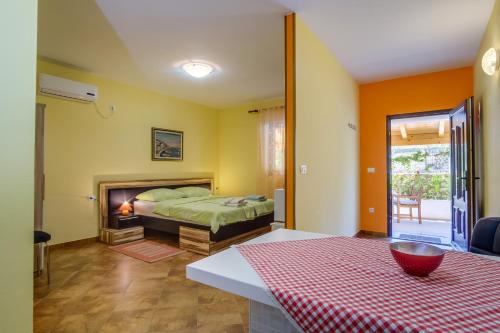 a bedroom with a bed and a fireplace at Abba Apartments in Mali Lošinj