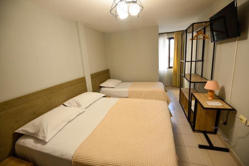 Postel nebo postele na pokoji v ubytování Hotel Niku
