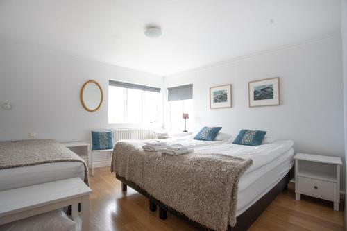 A bed or beds in a room at Old Airline Guesthouse