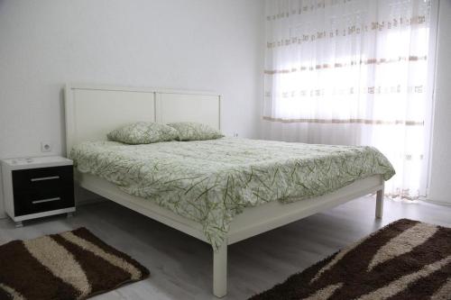 Postel nebo postele na pokoji v ubytování 7mi Septemvri