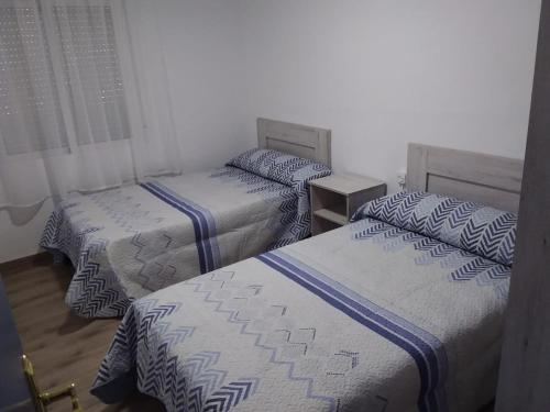 A bed or beds in a room at Apartamento Barcelo 4
