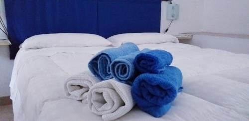 a bed with towels on top of it at Le Terrazze Sul Pollino B&B in Civita