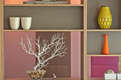 a shelf with vases and other items on it at Hérað - Berjaya Iceland Hotels in Egilsstadir