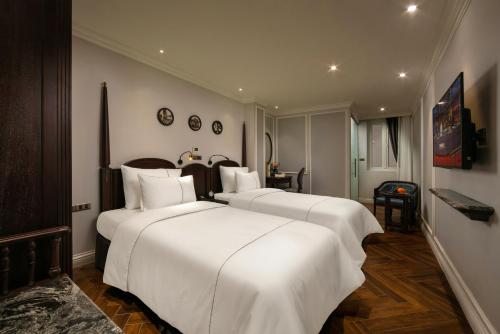 Postel nebo postele na pokoji v ubytování Canary Hotel