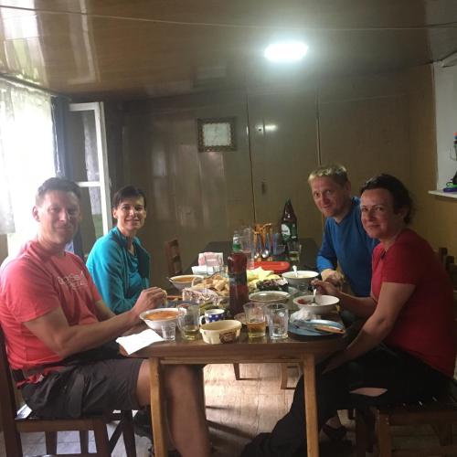 a group of people sitting around a table at Sweet home in Lalkhori