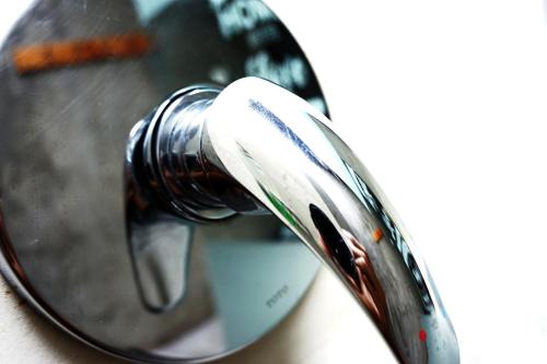 a persons reflection in a magnifying glass at Louto Dmell Villa & Guesthouse in Sanur