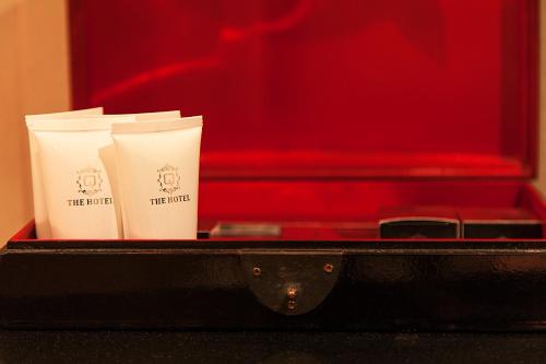 two cups of coffee sitting inside of a briefcase at Quentin Prague Hotel in Prague