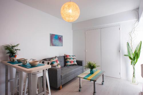 a living room with a couch and a table at Soho Point Central in Buenos Aires