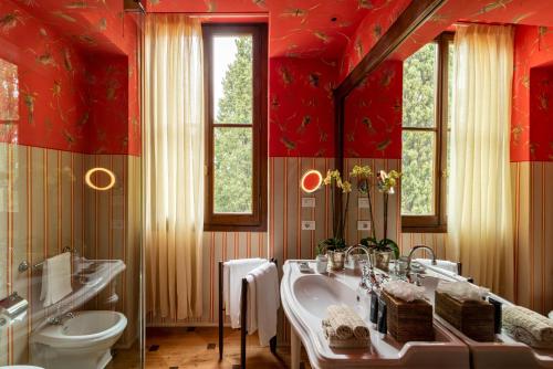a bathroom with a tub and a sink and a toilet at Il Salviatino Firenze in Florence