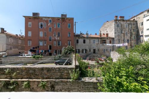 a view of an old city with buildings at La Preziosa Rooms in Pula