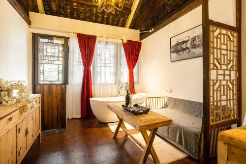 Χώρος καθιστικού στο Bliss Qintai Tibetan Boutique Hotel