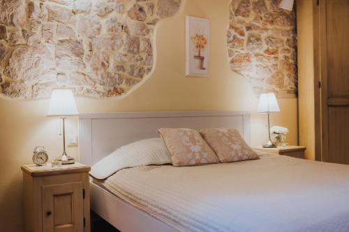 Postel nebo postele na pokoji v ubytování Rooms Villa Duketis