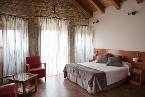 Cama o camas de una habitación en Casa Rural Abadia Eiras