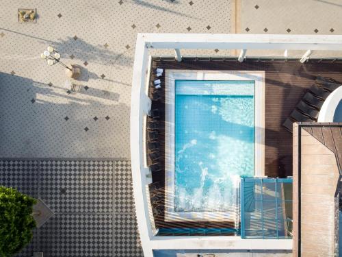 a swimming pool in the side of a building at aja Grömitz in Grömitz