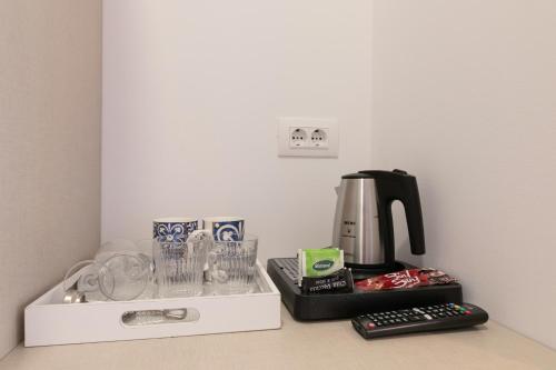 a coffee maker sitting on top of a counter at La Preziosa Rooms in Pula