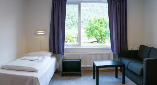 Gulta vai gultas numurā naktsmītnē Sogndal Bed & Breakfast
