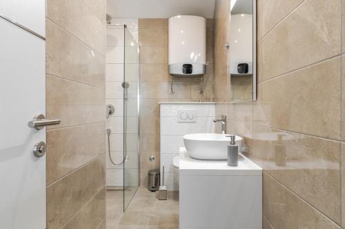 a bathroom with a sink and a shower at Apartments Mijo in Dugi Rat