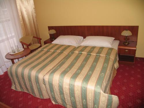 Ένα ή περισσότερα κρεβάτια σε δωμάτιο στο Hotel Morze
