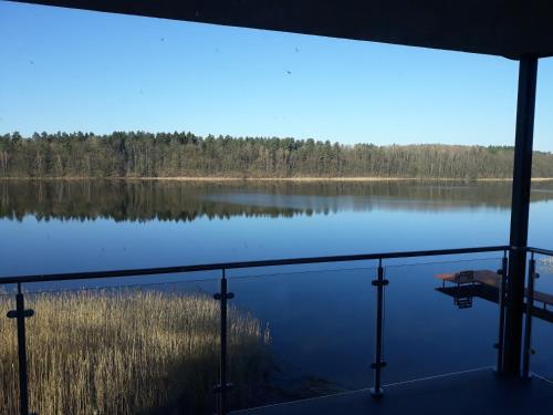 a view of a large lake from a boat at Mazurskie Klimaty Tatarak in Olsztyn