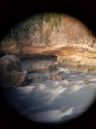 a view of a body of water with rocks at Apartamento El Palmar Residences in San Carlos