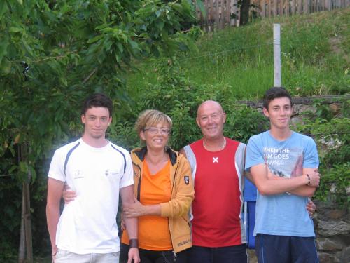 a group of people posing for a picture at Casa Bamby in Cogolo