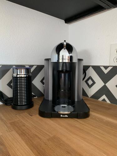 a coffee maker sitting on top of a table at The Cherokee House in Joshua Tree in Joshua Tree