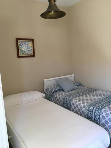 A bed or beds in a room at Ático Aretusa