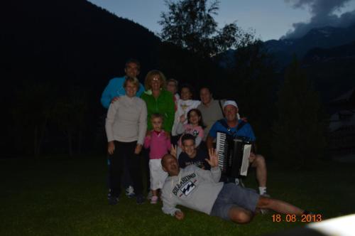 a group of people posing for a picture at Casa Bamby in Cogolo