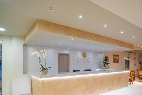 a lobby with a reception desk in a building at CNic Gemini Hotel in Mesongi