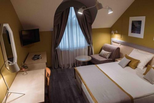 Katil atau katil-katil dalam bilik di Hotel Đakovo