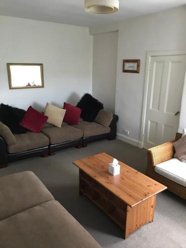 a living room with two couches and a coffee table at Ayrshire cottage in Kilmarnock
