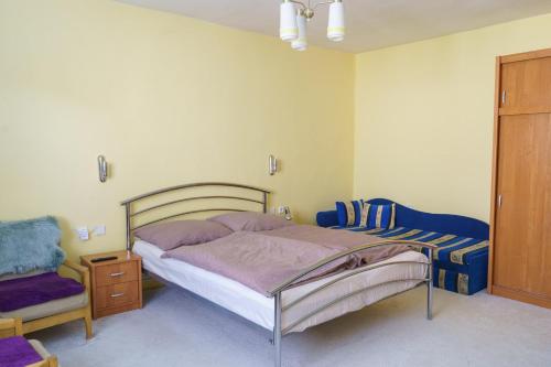 Posteľ alebo postele v izbe v ubytovaní Begónia-dom s jednou spálňou