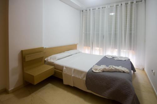 Cama o camas de una habitación en City of Arts & Spa Apartment