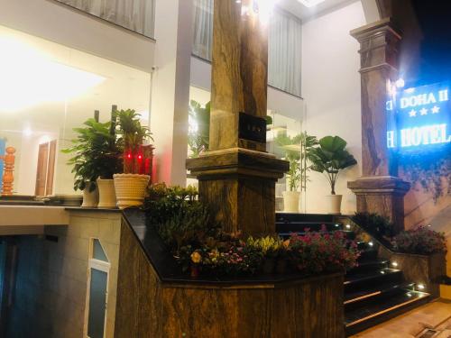 a flower shop with a bunch of plants on a counter at Doha 2 Hotel Saigon Airport in Ho Chi Minh City