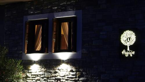 a building with a window with a sign that says argos at Agape in Kala Nera