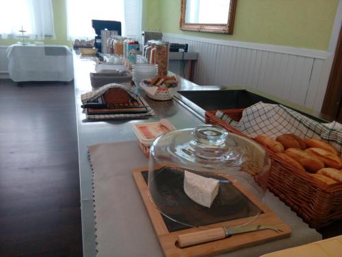 a counter with bread and a glass jar on it at Liahof in Ullared