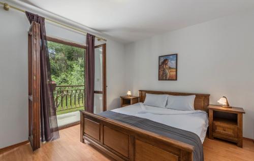 Postel nebo postele na pokoji v ubytování Apartments Rakovac