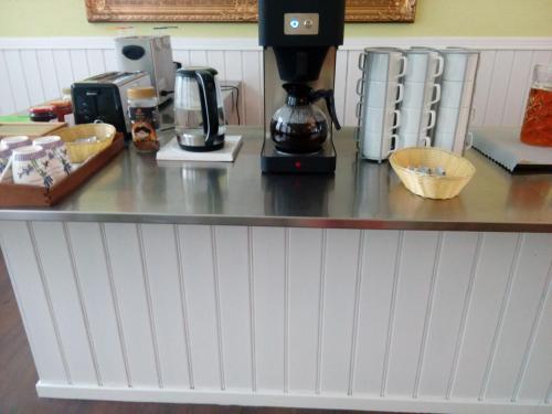 a counter top with a coffee maker on it at Liahof in Ullared