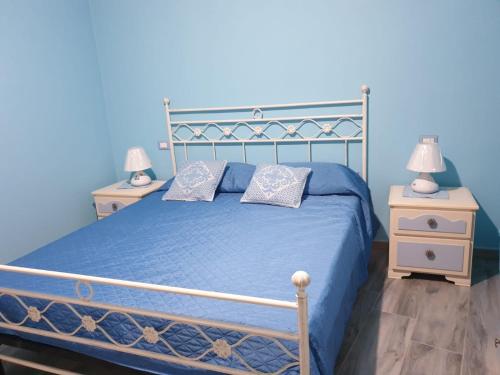 Ένα ή περισσότερα κρεβάτια σε δωμάτιο στο Casa vacanze El Flamingo Rosa Cod IUN P5386