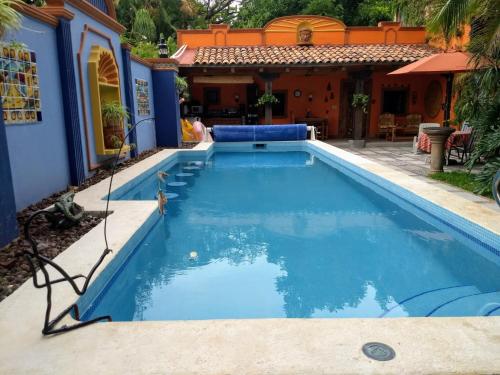 a swimming pool in the backyard of a house at Casa de Como in Ajijic