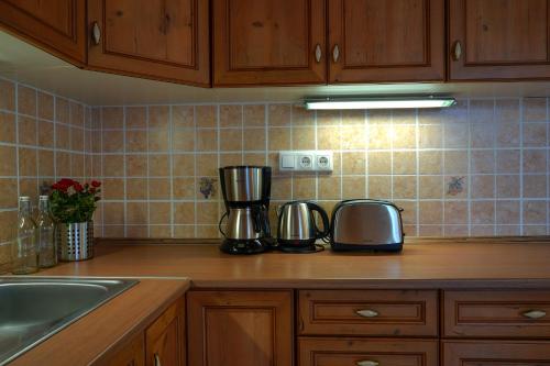 a kitchen counter with two appliances on top of it at Buda Side in Budakeszi