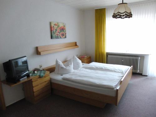 Кровать или кровати в номере Hotel Olympia