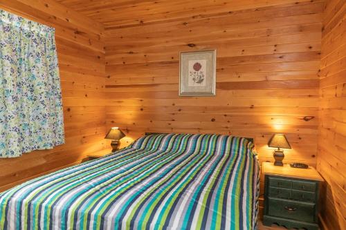 Voodi või voodid majutusasutuse Fairways Cottages toas