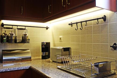 a kitchen with a counter with a coffee maker at Agape in Kala Nera