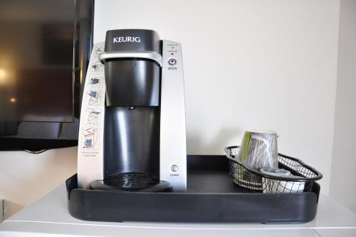 a coffee maker in a box on a counter at Moonlight Inn and Suites Sudbury in Sudbury