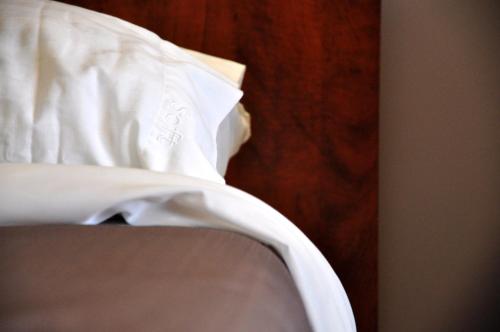 a white shirt sitting on top of a chair at Moonlight Inn and Suites Sudbury in Sudbury