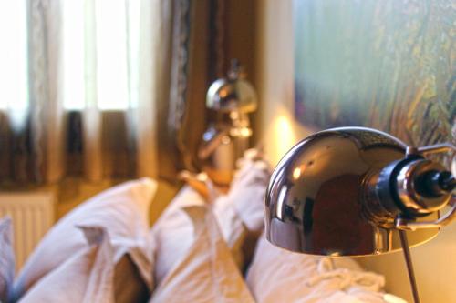 a camera is on top of a bed at Agape in Kala Nera
