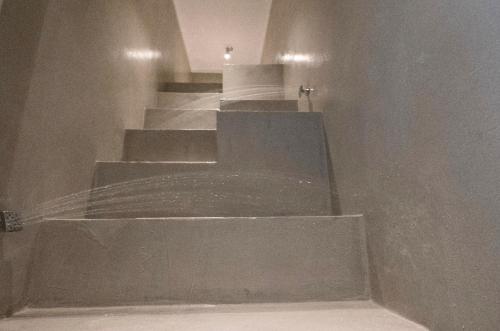 a set of concrete stairs in a building at Imera B&B in Favignana